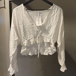 12th Tribe White long sleeve blouse Size S/M.